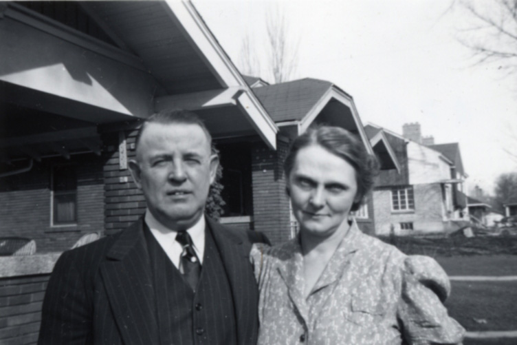 Grandpa & Mim in front of their home.